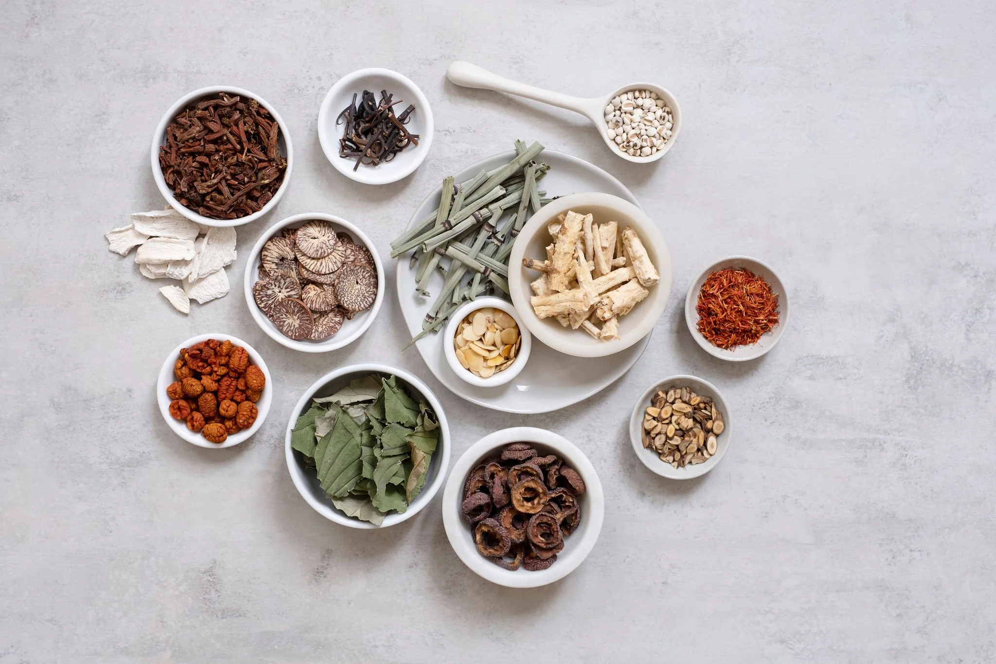 Overhead view of dried herbs and botanicals used in Daodi custom formulas